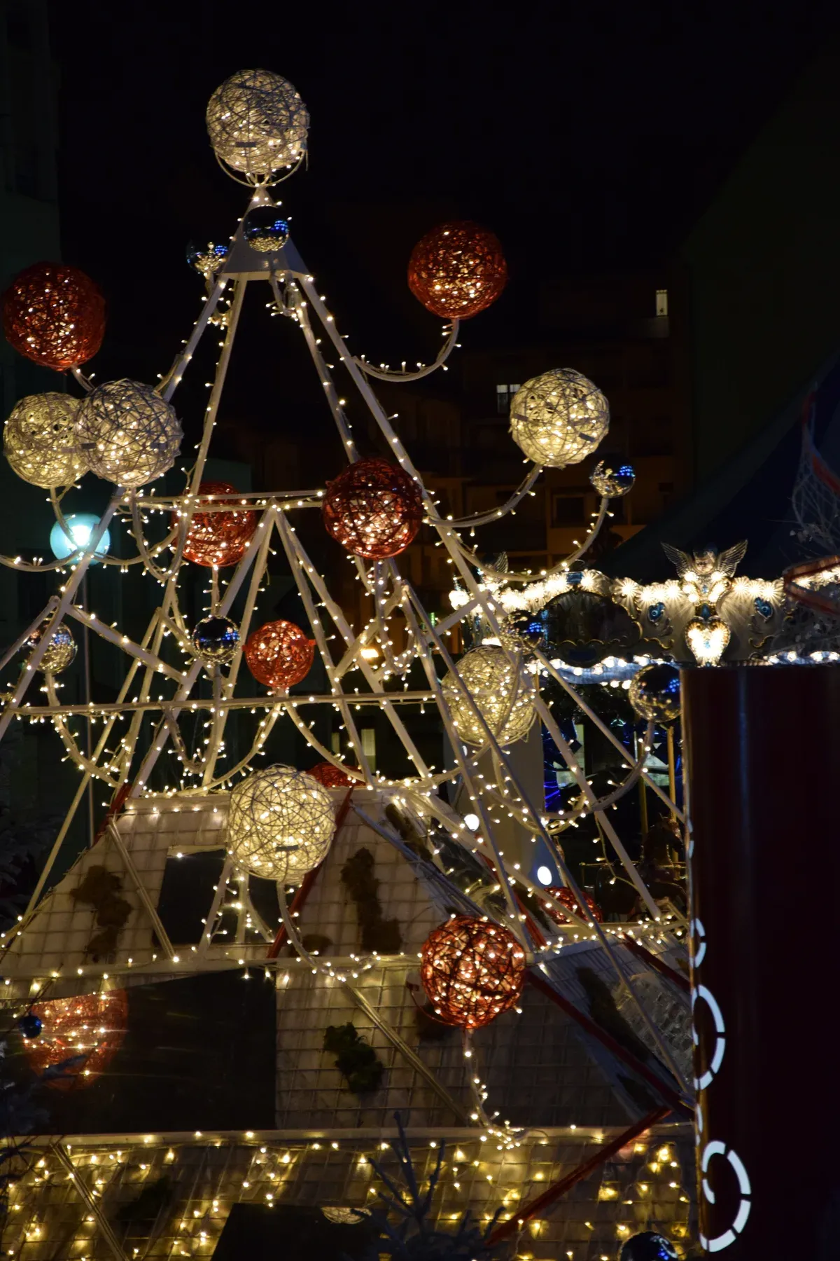 Light sculpture with glowing globes at the Colmar Christmas market
