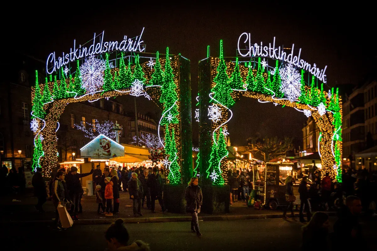 Illuminated Christkindelsmärik entrance arch at the Strasbourg Christmas market